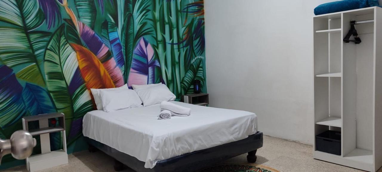 Garden House Puerto Lopez Hotel Bagian luar foto