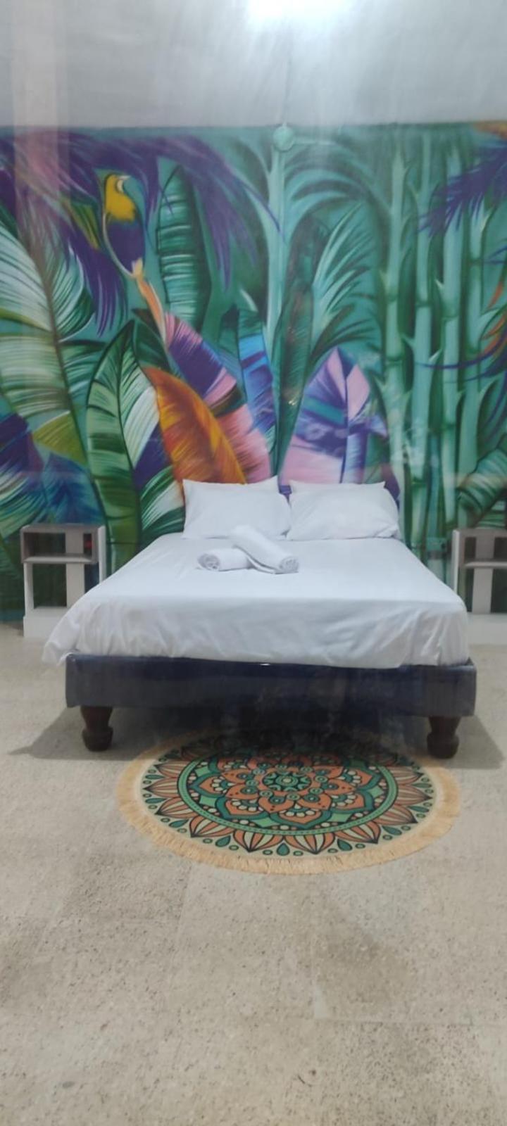Garden House Puerto Lopez Hotel Bagian luar foto